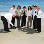 Group of businesspeople on the beach.